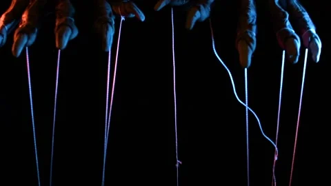 Metaphorical paws of the devil with threads for control Stock Footage 221271779