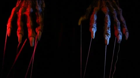 Metaphorical paws of the devil with threads for control Stock Footage 221271805