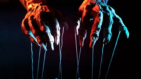 Metaphorical paws of the devil with threads for control Stock Footage 221273224