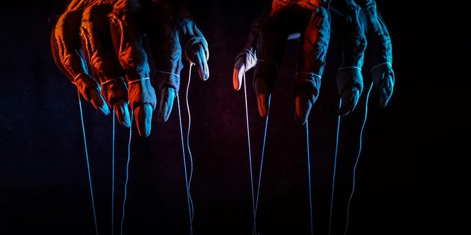 Metaphorical paws of the devil with threads for control Foto stock