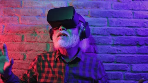 Metaverse virtual reality concept - Asian senior man wearing VR goggles Stock Footage 177944233