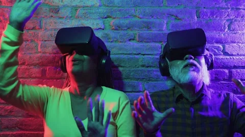 Metaverse virtual reality concept - Multiracial senior friends using VR goggles Stock Footage 177945871