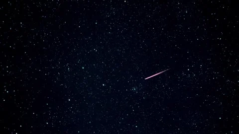 A meteor or comet streaking across a starry night sky Stock Footage 326328868