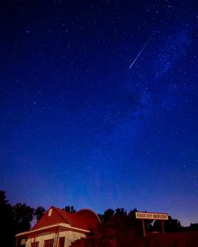 Meteor shower in sky Stock Photos