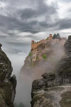 Meteora monastery complex, Greece. Orthodox monastery on the rock, emerging.. Stock Photos