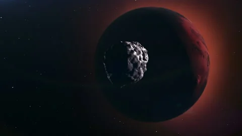 A meteorite is moving through space to meet the planet Mars. Stock Footage 172935586