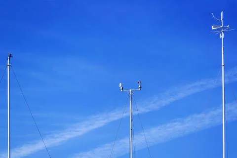 Meteorological instruments for measuring the wind speed against blue sky Stock Photos