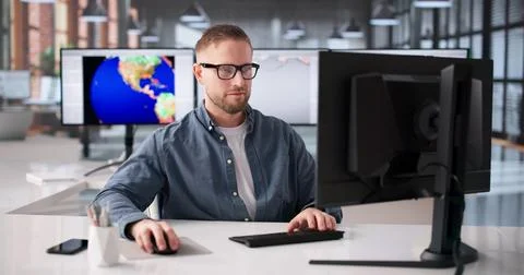 Meteorologist Analyzes Climate Data On Computer To Track Weather Changes Stock Photos