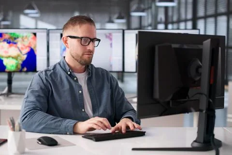 Meteorologist Examines Climate Data On Computer, Investigating Weather Patter Stock Photos