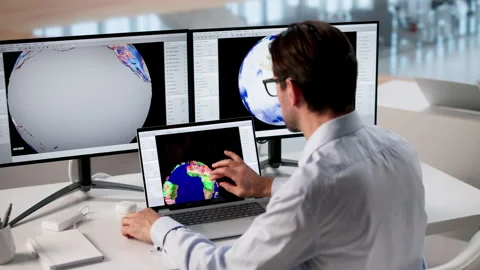 Meteorologist Studies Computer Data To Forecast Weather Stock Footage 333848652