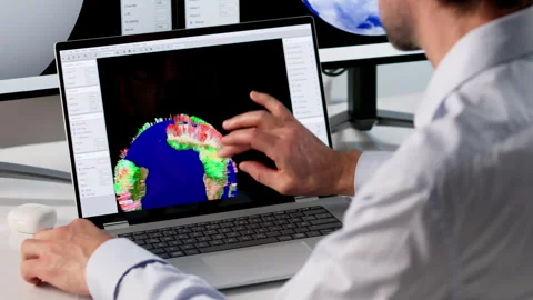Meteorologist Studies Computer Data To Forecast Weather Stock Footage 335458799