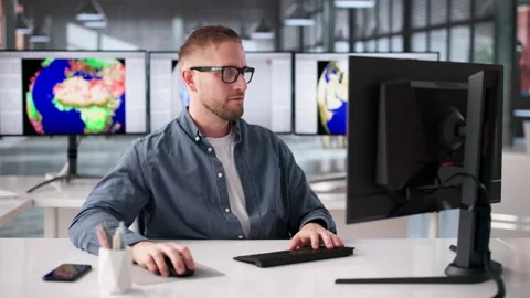 Meteorologist Studies Weather Patterns On Computer Stock Footage 331516151
