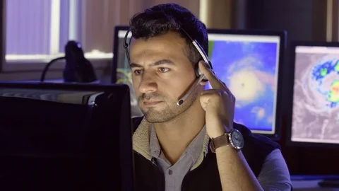 Meteorologist tracking hurricane activity on his computer screens 스톡 동영상 80207679