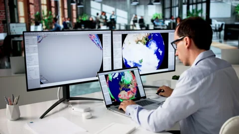 Meteorologist Uses Computer To Analyze Weather Forecast Stock Footage 334531711
