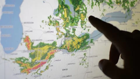 Meteorologist's hand watch wind storm hurricane with weather radar technology Video stock 200470165