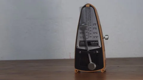 The meter in the corner of the table is ticking in 4K 動画素材 196742293