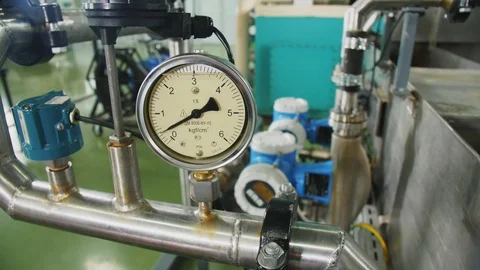 Meter pointer moves showing pressure level on pipeline Stock Footage 122017213