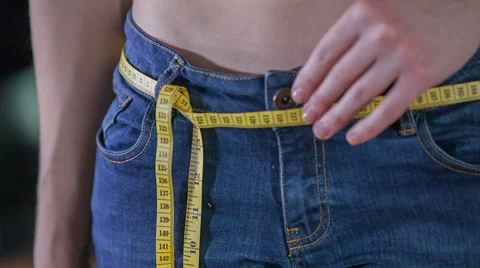 Meter tape in jeans instead of a belt Stock Footage 61696149