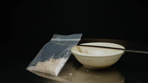 Methamphetamine drug in a plastic bag. Crystal meth or methamphetamine a re.. Stock Footage 321612403