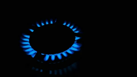 Methan gas kitchen stove while burning on dark background,energy supplies crisis Stock Footage 235544520