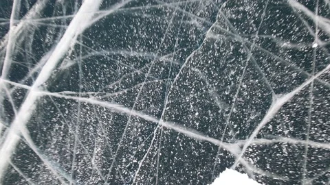 Methane Bubbles in Cracked Frozen Ice Surface at Baikal Lake in Russia in Winter Stock Footage 150951069