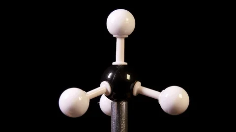 Methane CH4 molecule rotating on black background Stock Footage 107472156