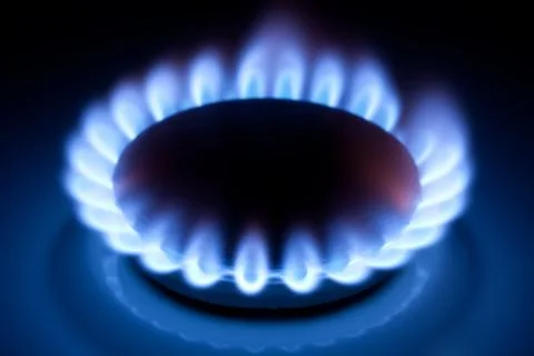 Methane flames at kitchen cooker Stock Photos