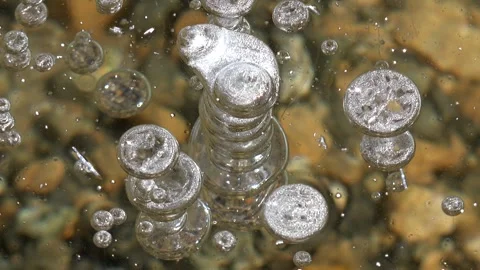 Methane gas bubbles stay trapped inside clear frozen lake ice - Stacked Bubbles Stock Footage 339817844