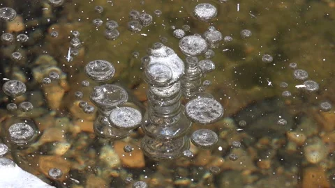Methane gas bubbles stay trapped inside - Gas Entrapment and Circular Bubbles Stock Footage 339817861