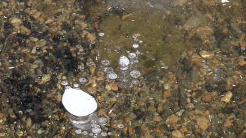 Methane gas bubbles stay trapped inside - Gas Entrapment and Stacked Bubbles Stock Footage 339817899