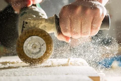 Method of artificial aging of wood. Drill with a wire brush. Stock Photos