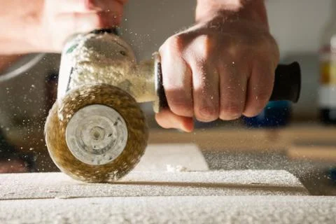 Method of artificial aging of wood. Drill with a wire brush. Stock Photos
