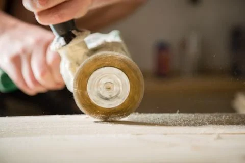 Method of artificial aging of wood. Drill with a wire brush. Stock Photos