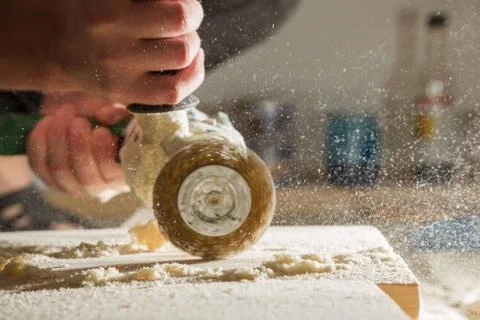 Method of artificial aging of wood. Drill with a wire brush. Stock Photos