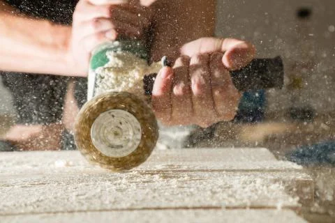Method of artificial aging of wood. Drill with a wire brush. Stock Photos