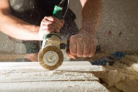 Method of artificial aging of wood. Drill with a wire brush. Stock Photos