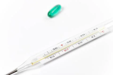 Method of temperature determination and treatment. Thermometer and medicines. Stock Photos