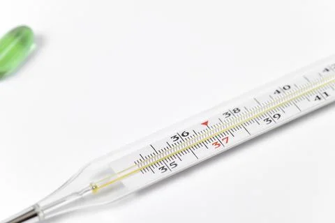 Method of temperature determination and treatment. Thermometer and medicines. Stock Photos