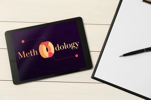 Methodology concept. Computer tablet, clipboard with paper and pen on white.. Stock Photos