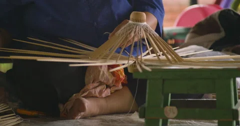Meticulous process of hand-lacing a unique, traditional Bo Sang umbrella. Stock Footage 310346477