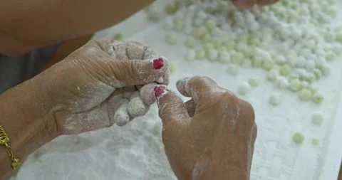 The meticulous process of making Bua Loi dough for a traditional Thai Bua Loi Stock Footage 338194670