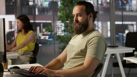 Meticulous staff member imputing data on computer in office Stock Footage 318159745