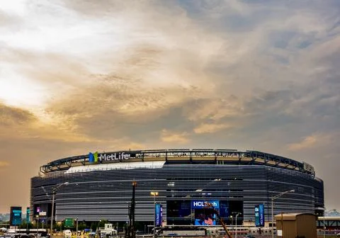 MetLife Stadium stands under a dramatic evening sky. Stock Photos