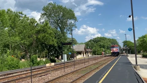 Metra Train Passes Through Kenilworth Station Stock Footage 155910724