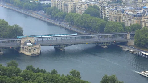 Metro circulating on the Bir Hakeim bridge seen from the Eiffel Tower in Paris Stock Footage 200155302