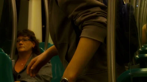 Metro interior people getting up for stop at subway station. Stock Footage 42398173