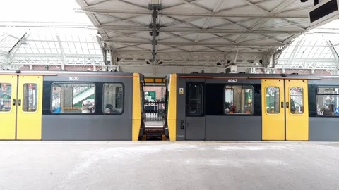 Metro light rail train at platform with doors closing and leaving Stock Footage 170832742