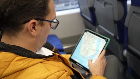 Metro map on tablet computer in train Stock Footage 164529587