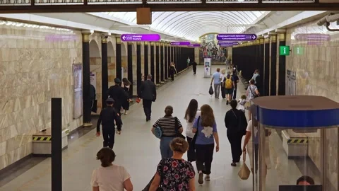 Metro passengers rushing platform toward arriving trains Stock Footage 331818765