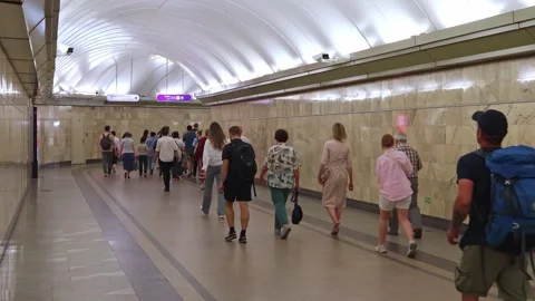 Metro passengers walking corridor toward train platform Stock Footage 331818777
